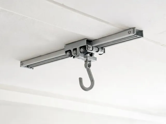 Hook mount and trolley interface on a rail