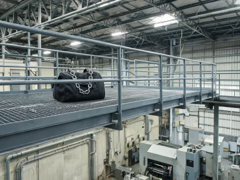 Maintenance mezzanine with chain bag